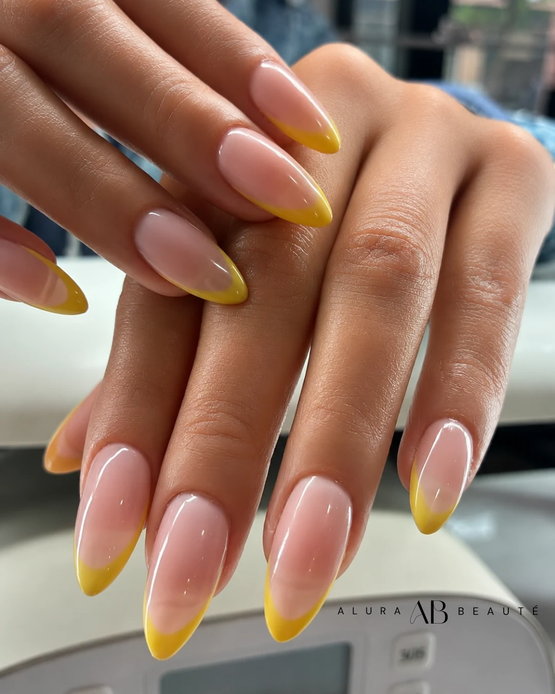 Alura Beaute almond nails with a lemon French tip
